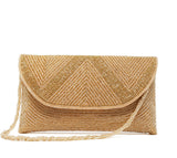 Gold clutch Back is covered with tiny rose-gold beads, fold-over snap closure.