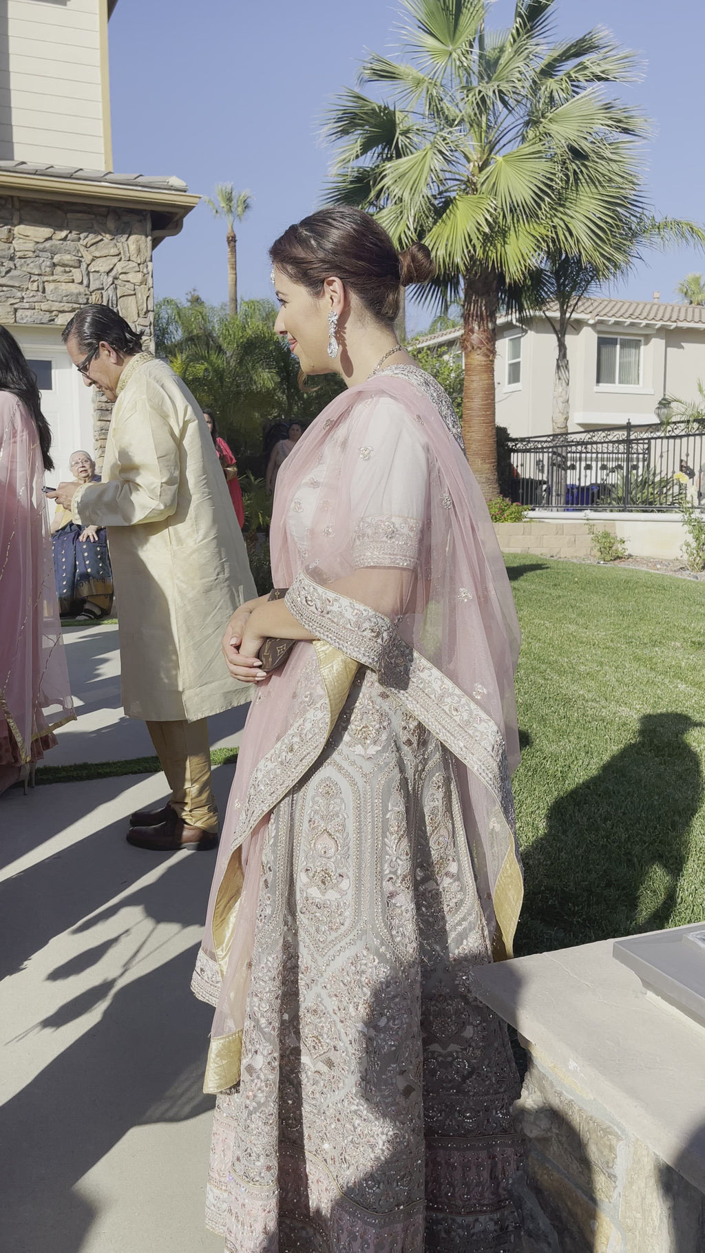 Gray silk lehenga paired with a matching top and the perfect pink dupatta
