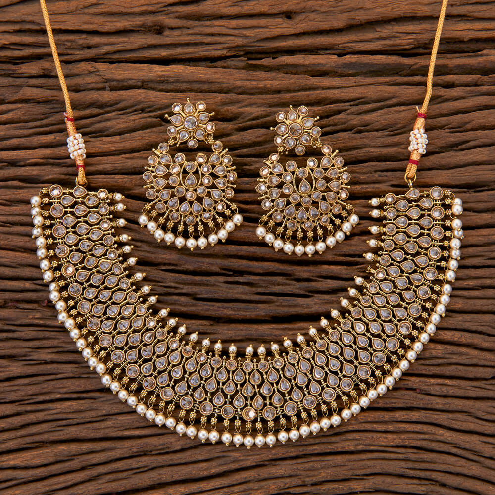 A Champagne Gold traditional jewelry, ivory 2 piece set: Necklace with earrings.