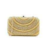 Ivory and gold clutch heavily embroidered with fold-over clasp closure