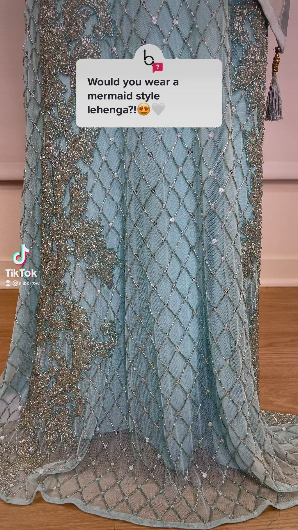 Light blue mermaid-style lehenga by Sherri Hill with court train long skim skirt & sleeveless crop top
