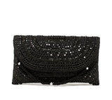 Black, twisting beaded wristlet with silver crystals evening bag embroidered with beads and rhinestones.