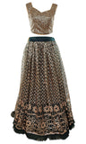 Forest green lehenga with gold/champagne sequins and borders of the lehenga decorated with pearls.