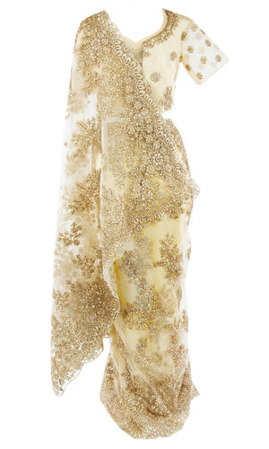 Gold net Saree pair with matching blouse finished with a lovely scalloped border. Gold sequins and glitter work.