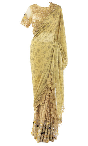 Stunning net blouse saree with moti work and embellished with 3D black and embroidered with gold beads is made.