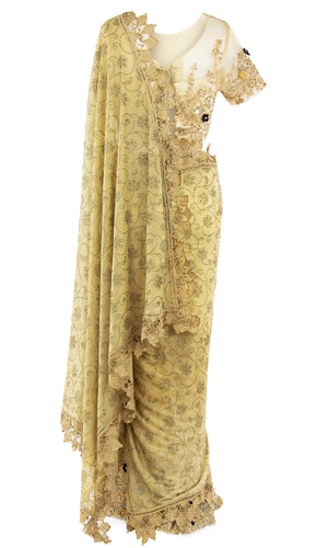 A beautiful net blouse saree with moti work that is adorned with 3D black and gold bead embroidery is produced.