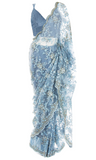 Pale blue silk top, paired with a lacy net saree embellished with beaded blue and silver florals.