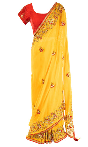 The classic red blouse has the sweetest touch of Zari work on the sleeves. with Blouse is adjustable.