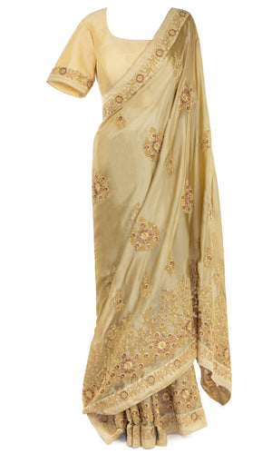 Silky-smooth beige classic satin silk top paired with a matching Saree embellished with gorgeous stonework