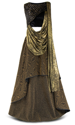 Black and gold sequined top paired with a brown and gold patterned skirt