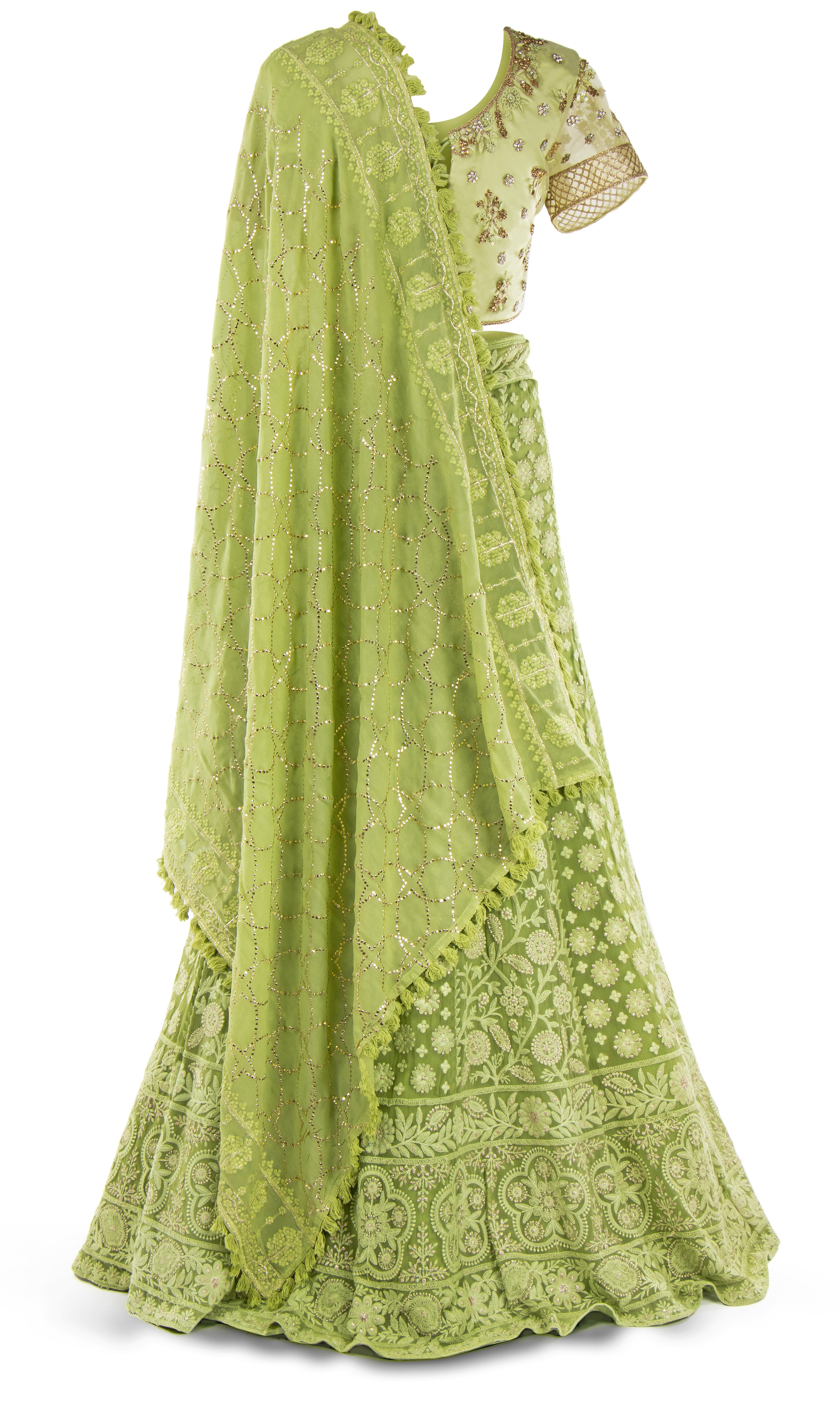 Lime green lehenga paired with a matching skirt and jeweled dupatta with fringe takes it to the next level.