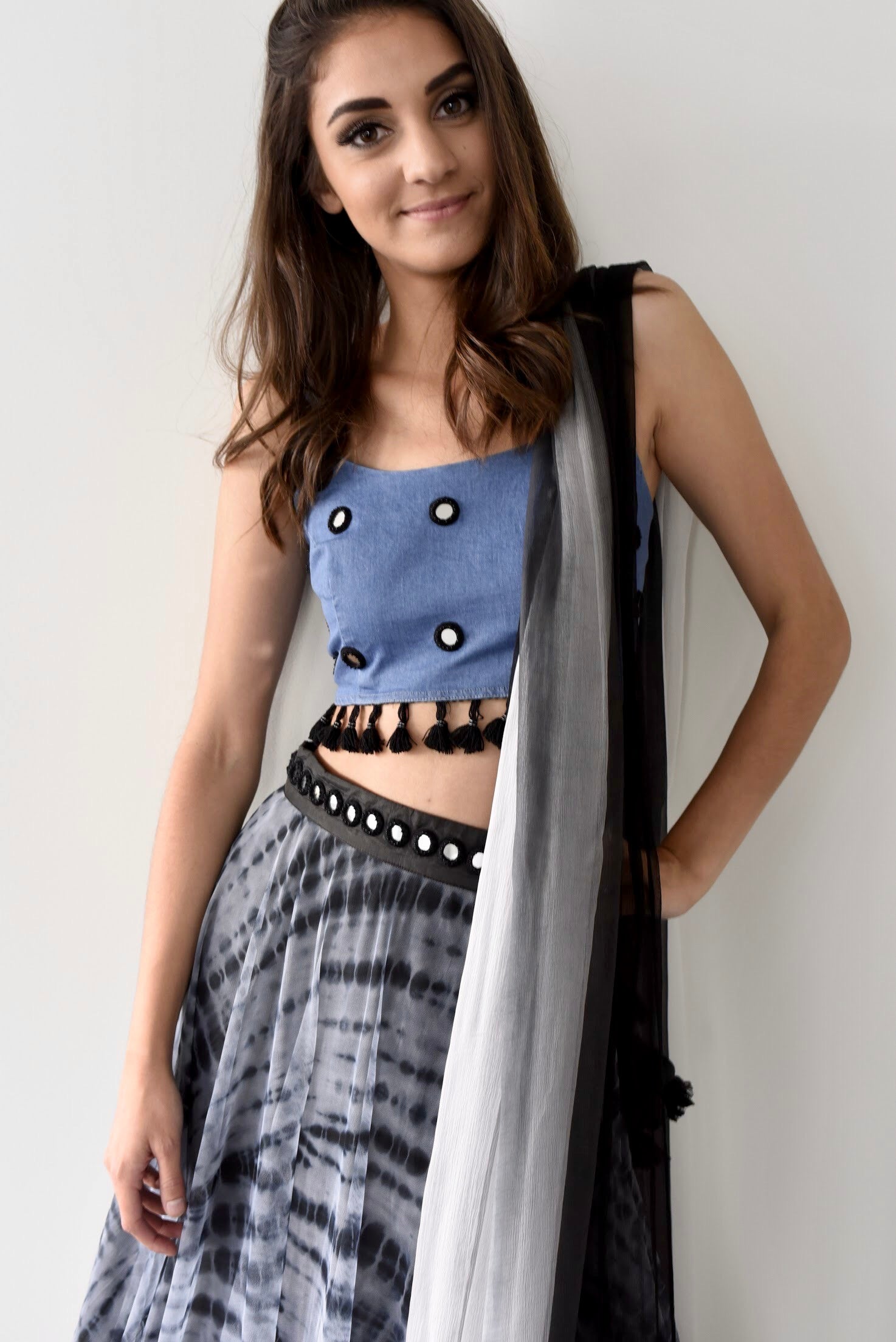 The jean blouse is also embroidered with fun mirror work through out and has hanging black tassels at the bottom!