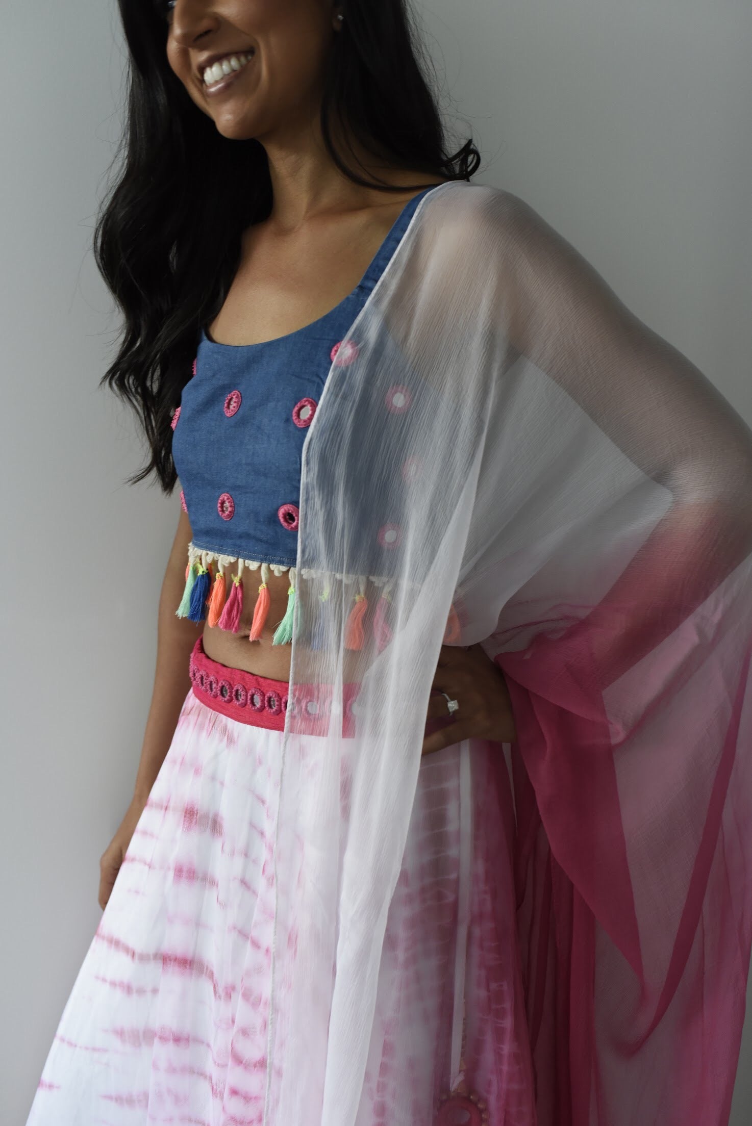 The dupatta is an ombre from pink to white. The blouse is jean material,The skirt is pink and white tie dye and the material is super flowy.
