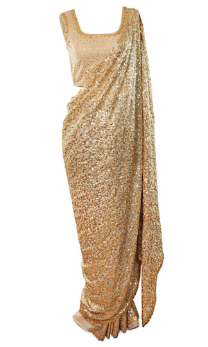 Gorgeous gold color georgette Saree is fully covered with sequins & paired with a sequined sleeveless blouse.