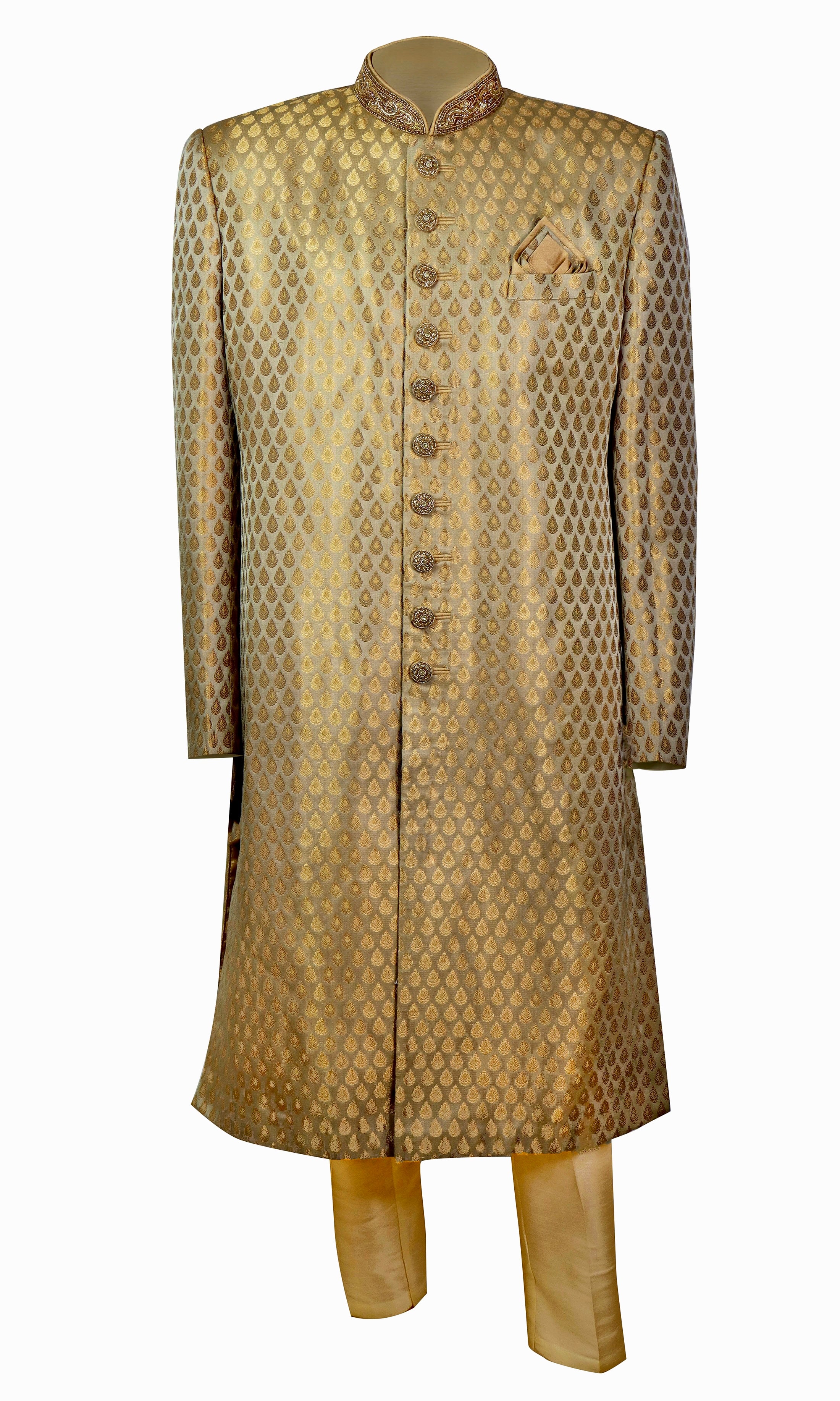 Gold sherwani is so smooth and shiny with subtle beaded embroidery on the buttons and the collars.