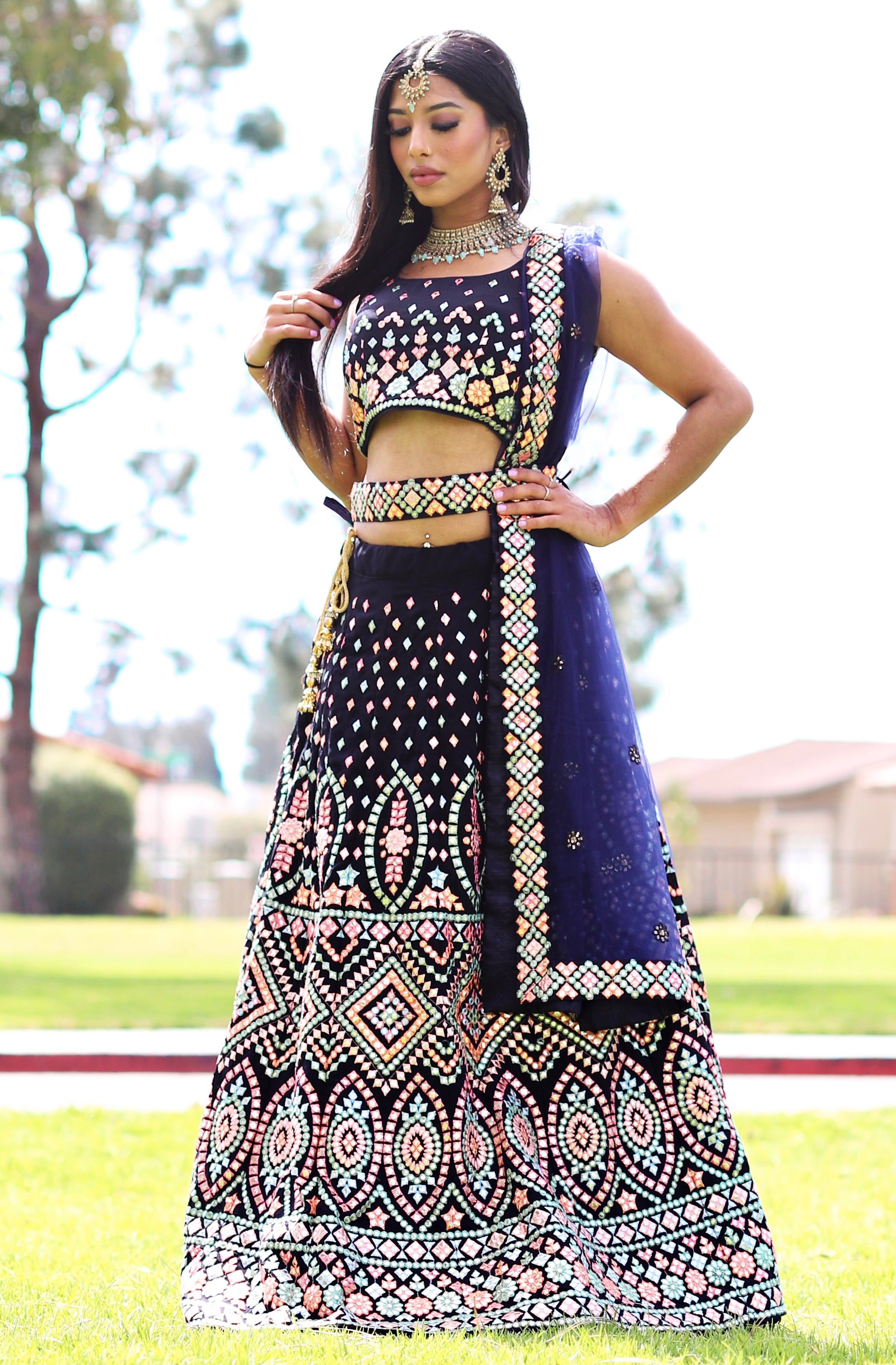 Black/dark navy lehenga set has colorful mirror work embroidery comes with net dupatta