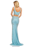 Light blue mermaid-style lehenga by Sherri Hill with damask style pattern on the sides.