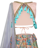 Stunning midi length skirt custom piece paired with blouse that has gold and silver embroidered beading border with a unique open back decorated with blue tassels.