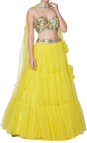 Bright yellow designer lehenga by Preeti S Kapoor, matching blouse & tulle dupatta.