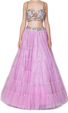 A beautiful lehenga is embroidered with silver sequins on a dupioni foundation and paired with a blouse.
