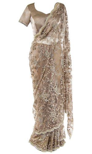 Classic Taupe Silk Saree is pre-pleated for your convenience. Blouse is adjustable.