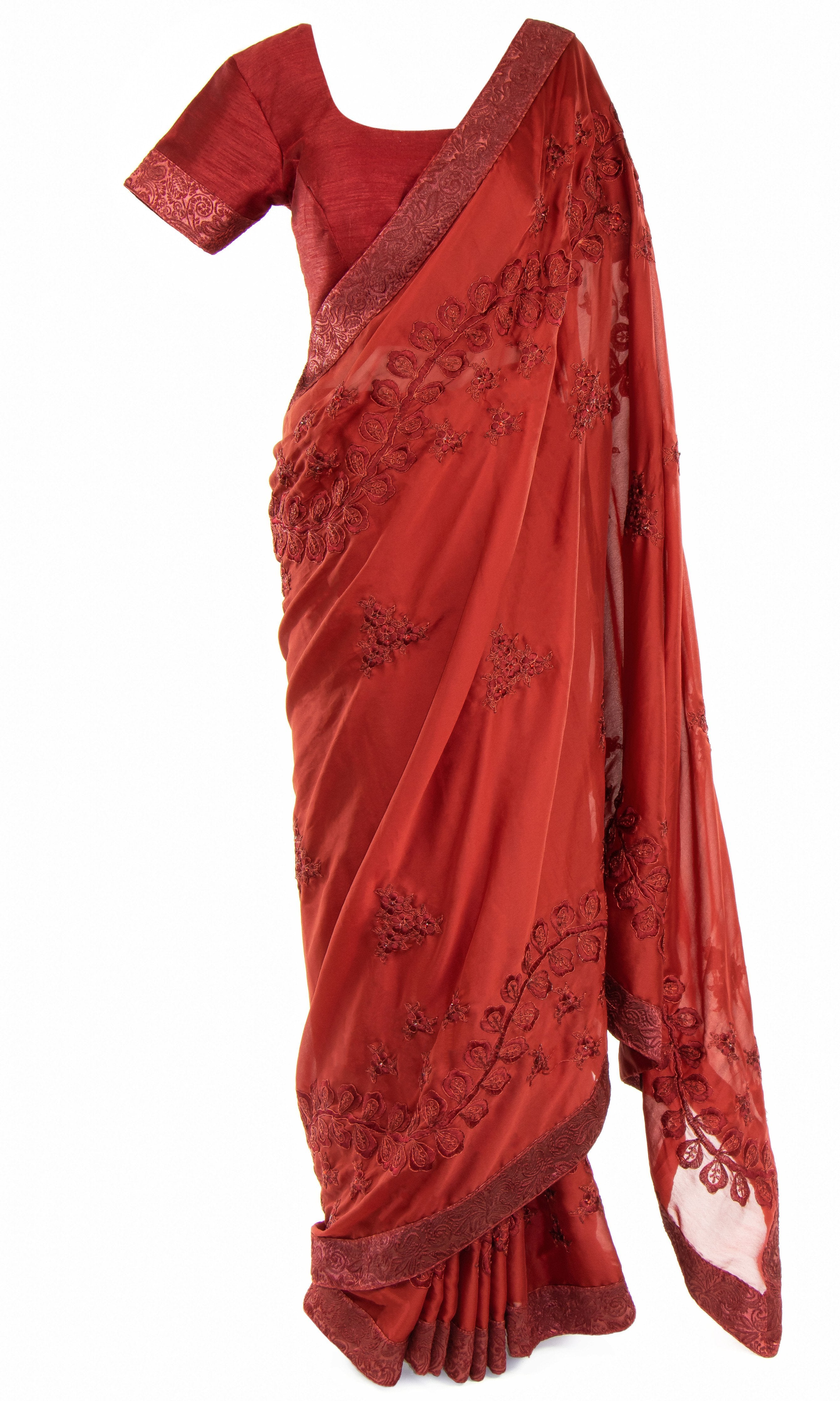 Pre-pleated burgundy Saree with beautifully embroidered cuff classic top & has an elegant vine design & stonework