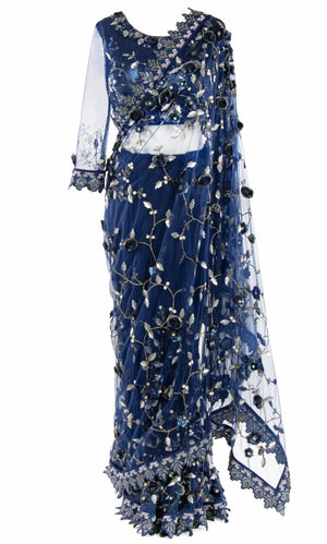 This navy sequined blouse has full see-through sleeves and detailed embroidered cuffs.