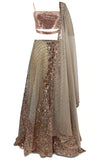 GLAMOROUS, burnt onion designer lehenga by Surabhi Chopra with silver beads and gold rose sequins