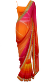 The vibrant orange, pink, red, and yellow ombre colors stand out and make this the perfect sari for any occasion!