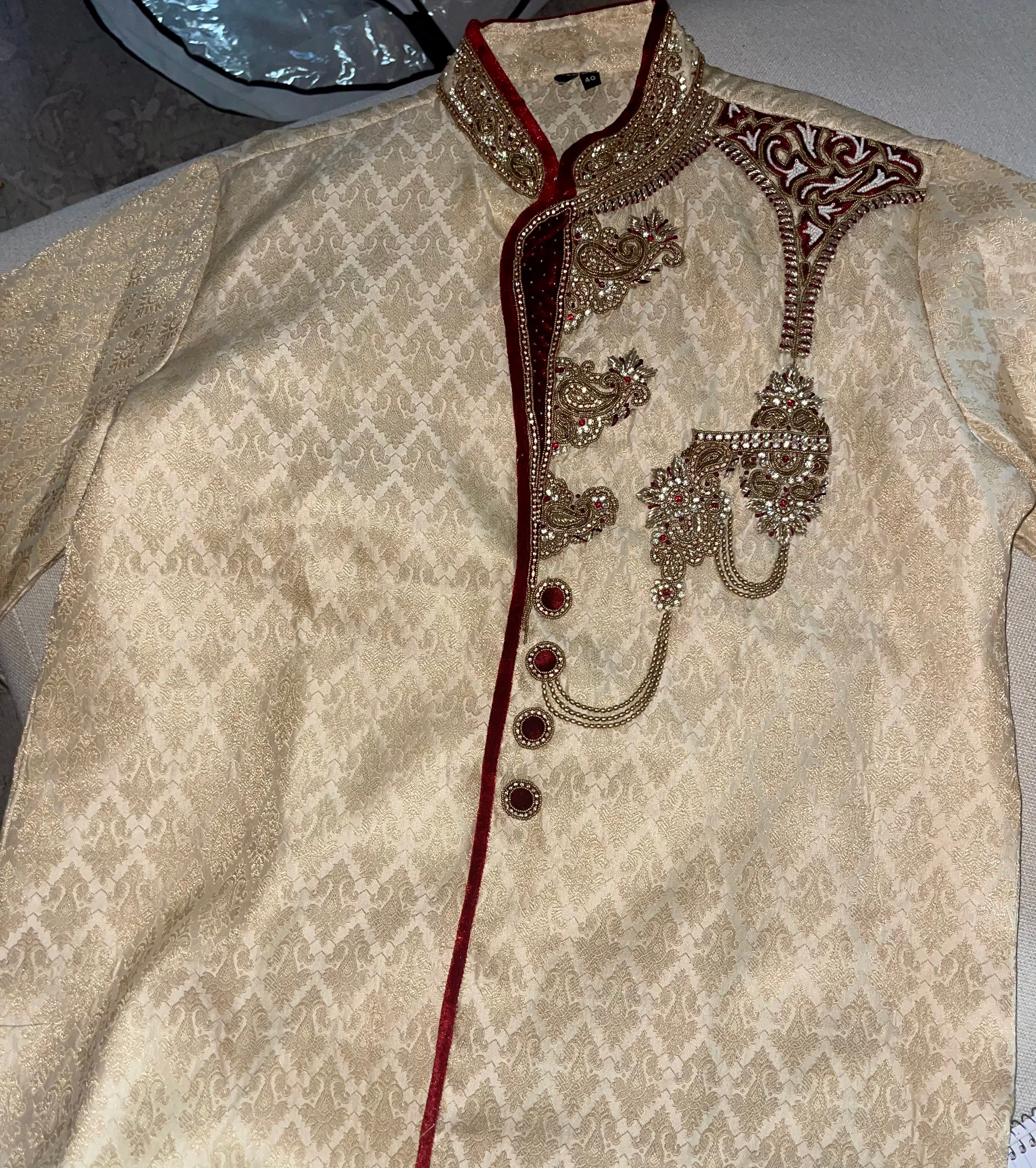 Royal Sherwani in gold color, work on sherwani gold threadwork and crystals.