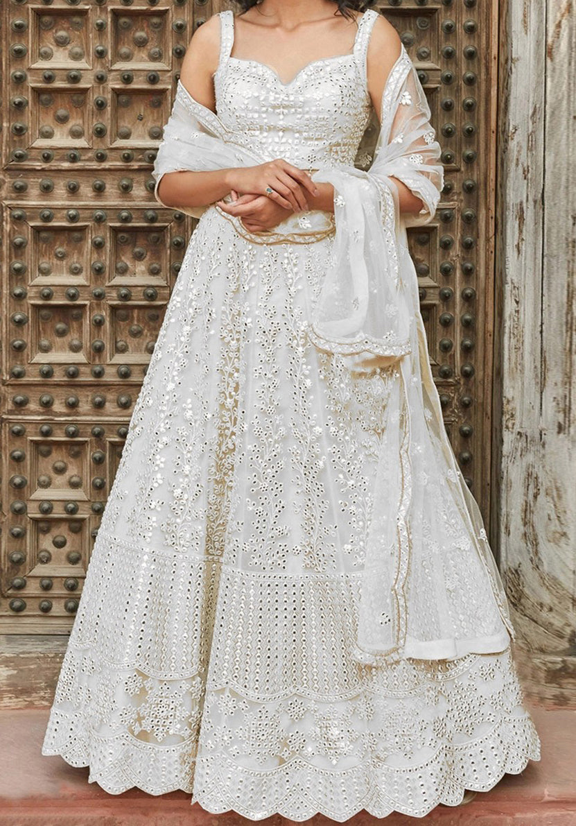 A walking snow angel, gorgeous lehenga is all white and decked out with stunning mirror work.