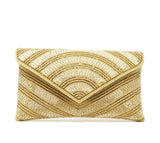 Shiny gold clutch and evening bag. Covered with gold beads, rhinestones, and crystals