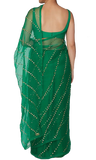 Pre-pleated emerald green saree by Rania with silk organza base, adjustable Blouse & Matching petticoat