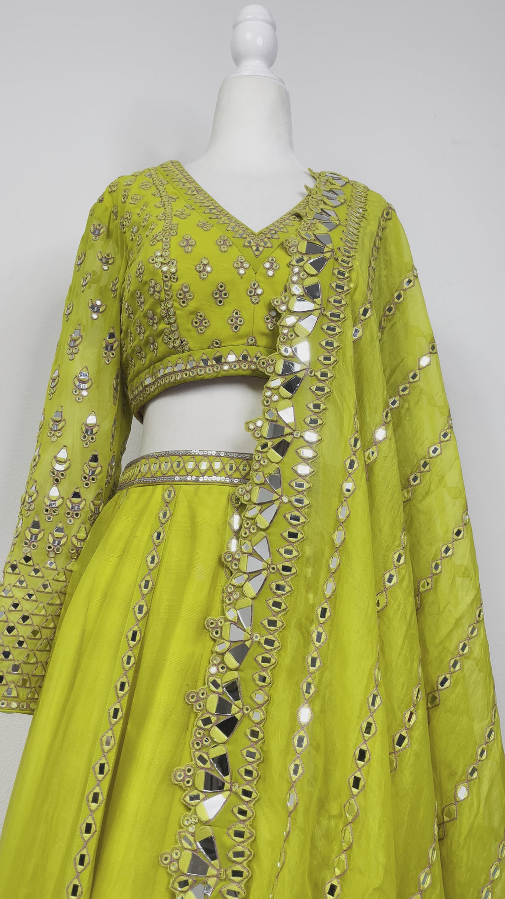 Moss Green/yellow Vvani 3 piece lehenga including skirt, blouse,& dupatta with mirror work by Vani Vats