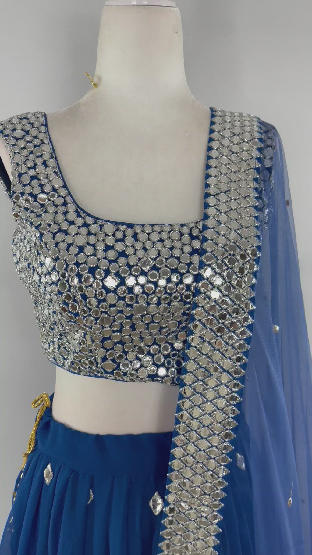 Deep blue lehenga covered in mirror work with net dupatta & matching blouse