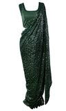 Dark green fully sequined Saree covered with sequins and paired with a sequined sleeveless blouse.