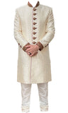 Beige/off-white sherwani embroidered with gold motifs.