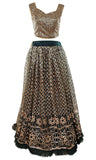 Forest green lehenga with gold/champagne sequins and borders of the lehenga decorated with pearls. 