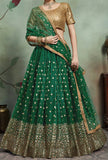 Beautiful 3-piece ensemble with a lehenga in green and gold. Beautiful gold sequined embroidery adorns the entire blouse.