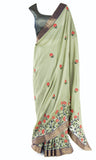 Olive silk Saree embroidered with a pink floral design and a gold border