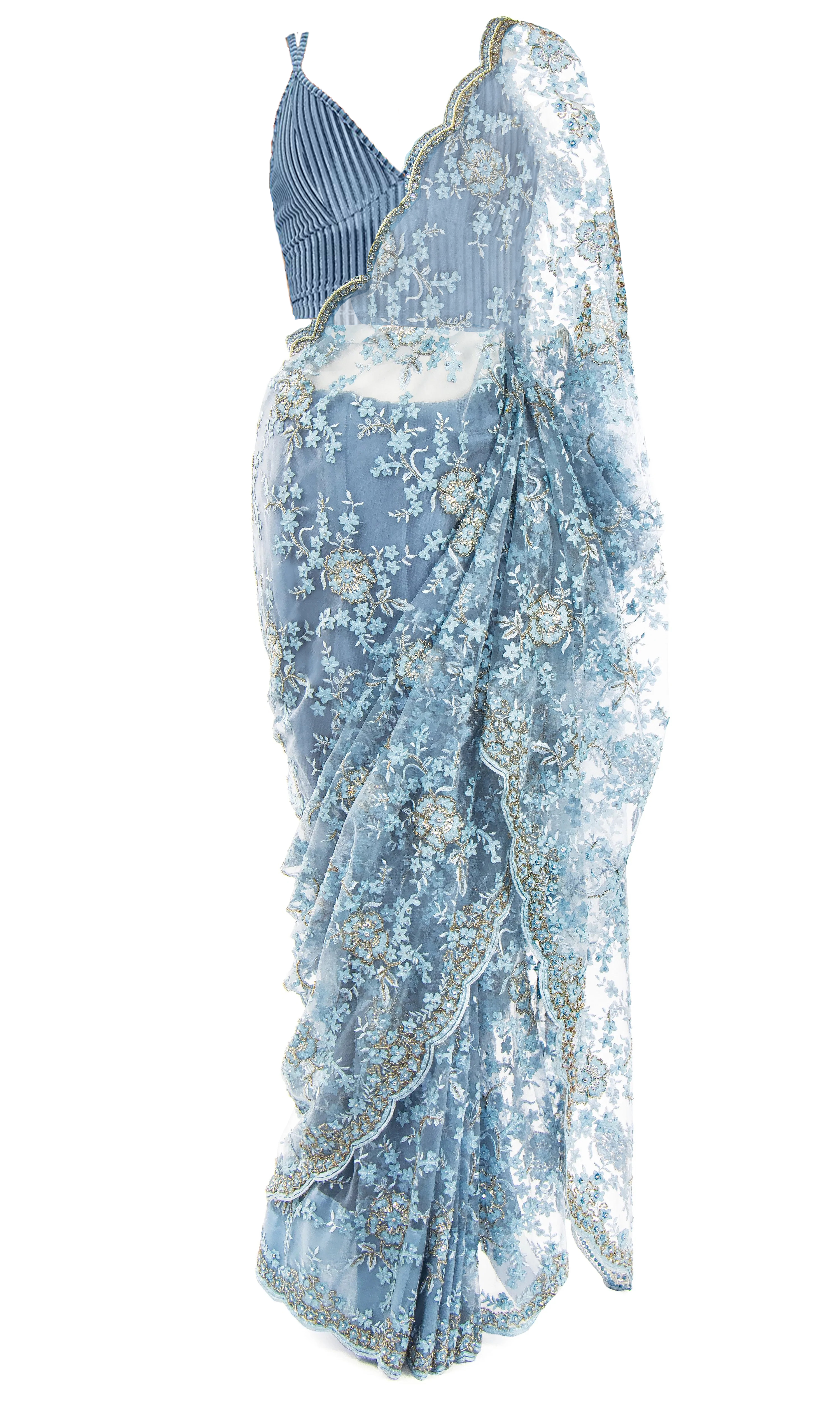  Pale blue silk top, paired with a lacy net saree embellished with beaded blue and silver florals.