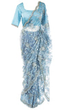 Pre-pleated lacy net saree, paired with  blue silk top is studded with diamonds.
