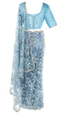 Lacy net saree, embellished with beaded silver florals & paired with pale blue top included petticoat.
