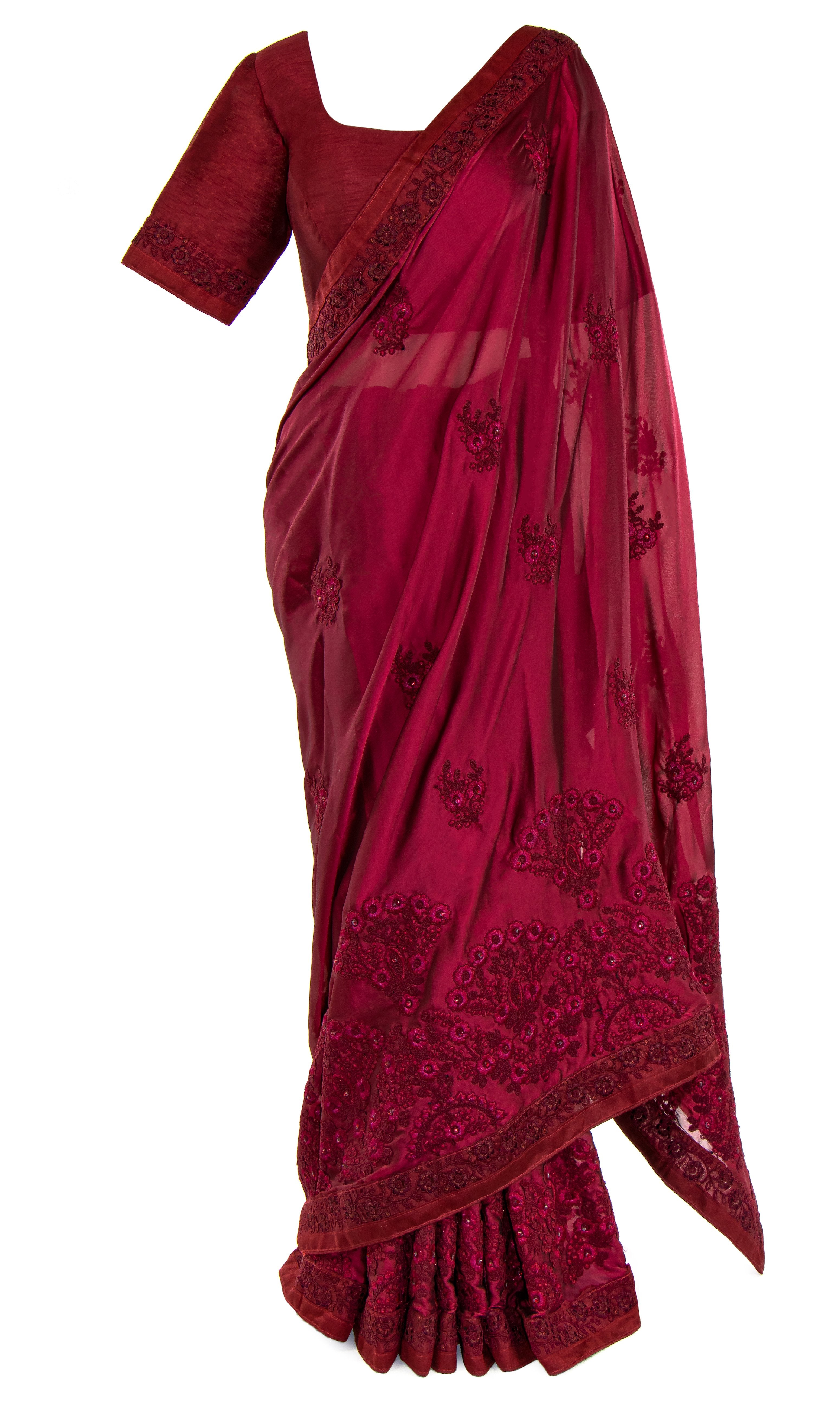 Maroon silk top features beautiful floral embroidered cuffs. It’s paired with an elegant matching Saree.