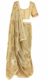 Silky-smooth beige Classic satin silk top paired with a matching Saree & embellished with gorgeous gold stonework. 