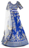 Heavily embroidered blue legenga with matching skirt and white net dupatta