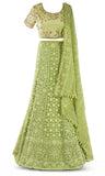 Lime green lehenga paired with a matching skirt with a gorgeous floral pattern garnished in crystals.