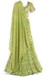  Lime green lehenga paired with a matching skirt and jeweled dupatta with fringe takes it to the next level.