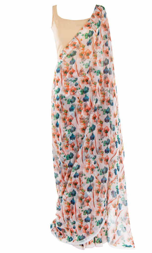 A peachy, multicolor floral printed Saree is the perfect match for this classic sleeveless peach/cream blouse.