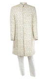 Neutral silk Sherwani embroidered with handsome cream threadwork and gold buttons for a touch of class.